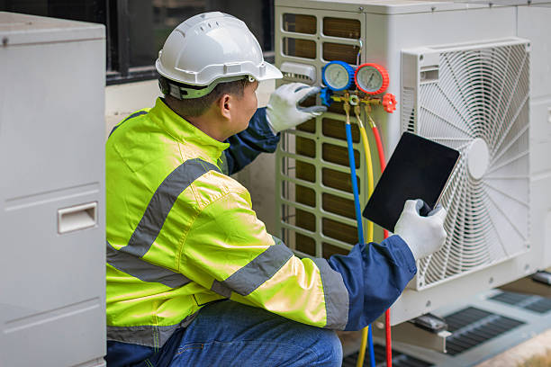 Professional Hvac technician working in Bellport, NY